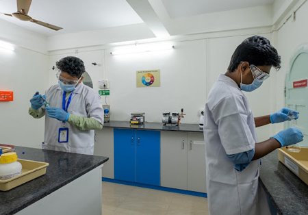 Analysts preparing samples at the bench